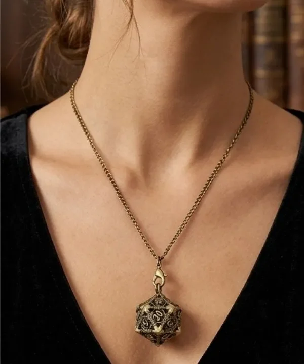 Alternative view of Porte-clés pendentif D20 creux bronze avec mini set de dés JDR