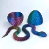 Serpent articulé violet iridescent et œuf de dragon impression 3D PLA Silk.