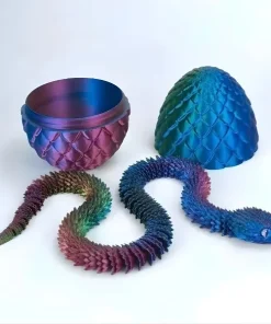 Serpent articulé violet iridescent et œuf de dragon impression 3D PLA Silk.