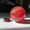 oule de quartz rouge à surface brillante pour décoration spirituelle
