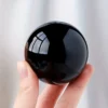 Boule de cristal en obsidienne noire naturelle de 60 mm à finition polie miroir