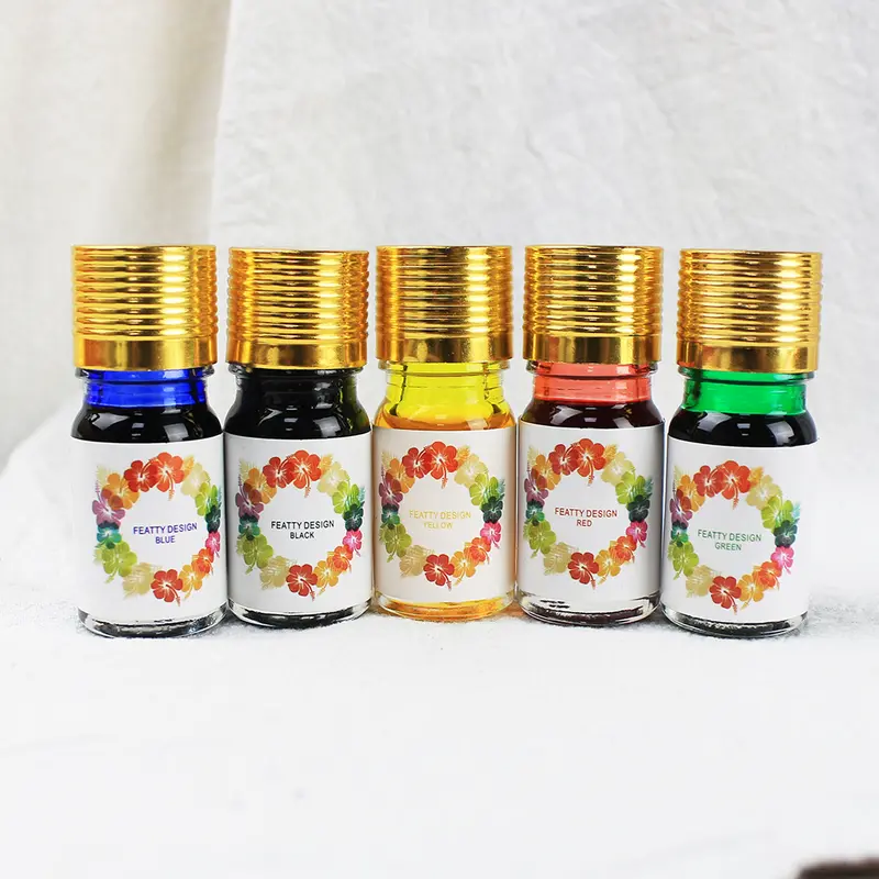 Coffret écriture à la plume avec encres et socle doré